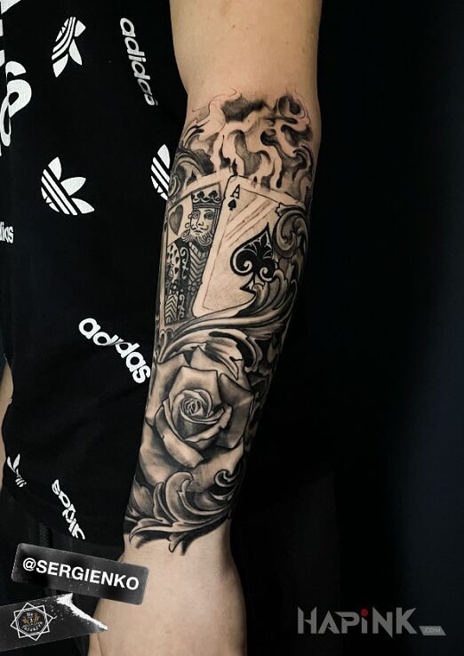 Tattoo KARTY RÓŻA in flowers motif and realistic style On the arm