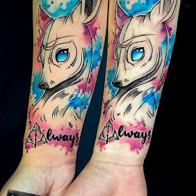 Tattoo FRIENDSHIP MATCHING ELKS on the forearm motif: lettering style: cartoon / comic book