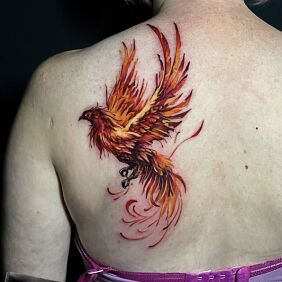 Tattoo COLORED PHOENIX on the back motif: fantasy style: realistic