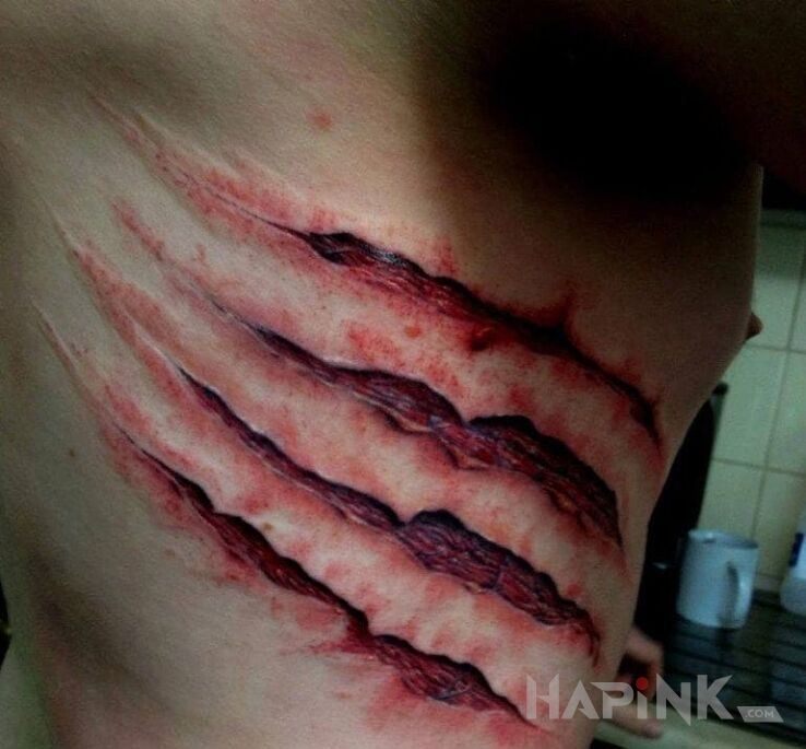 Tattoo Spotkanie z bestią in 3D motif and realistic style on the ribs