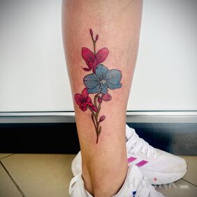 Tattoo ORCHID on the leg motif: colorful style: graphic / illustrative
