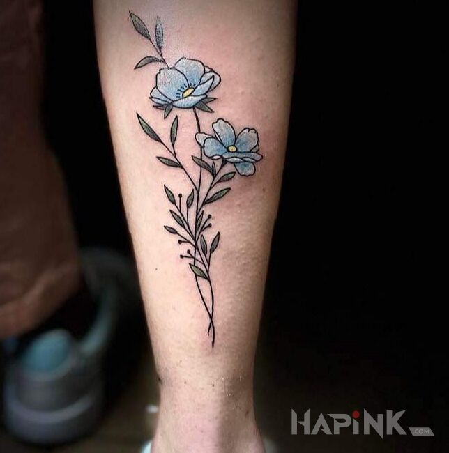 Tattoo FORGET-ME-NOTS in graphic / illustrative style on the calf