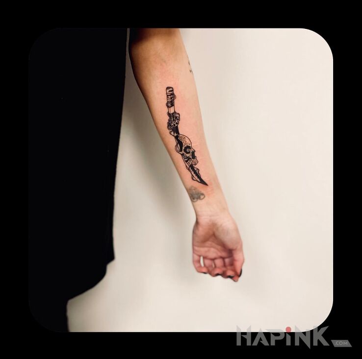 Tattoo KATANA WITH SKULL in skulls motif and graphic / illustrative style on the forearm