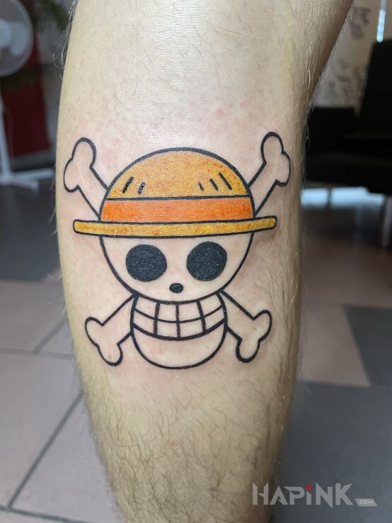 Tattoo ONE PIECE in manga / anime motif and graphic / illustrative style on the leg