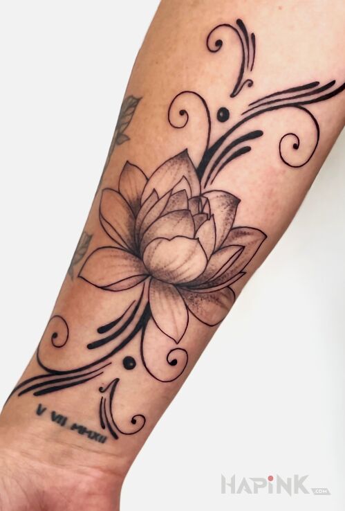 Tattoo LOTUS FLOWER in black and gray motif and graphic / illustrative style On the arm
