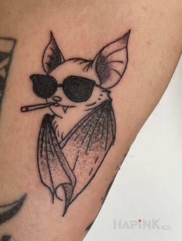 Tattoo BAT FLASH in black and gray motif and dotwork style On the arm