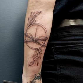 Tattoo DRAGONFLY WITH BRANCHES On the arm motif: insects style: graphic / illustrative