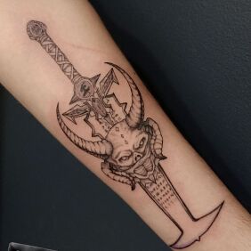 Tattoo MASCULINE DEMONIC SWORD On the arm motif: demons style: graphic / illustrative