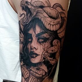 Tattoo MALE FEMALE SNAKE ARM TATTOO on the upper arm motif: dark style: sketch