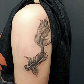 Tattoo KOI FISH On the arm motif: black and gray style: graphic / illustrative