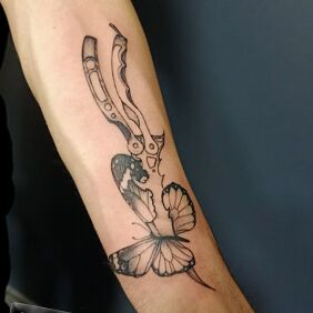 Tattoo BUTTERFLY KNIFE on the forearm motif: insects style: graphic / illustrative