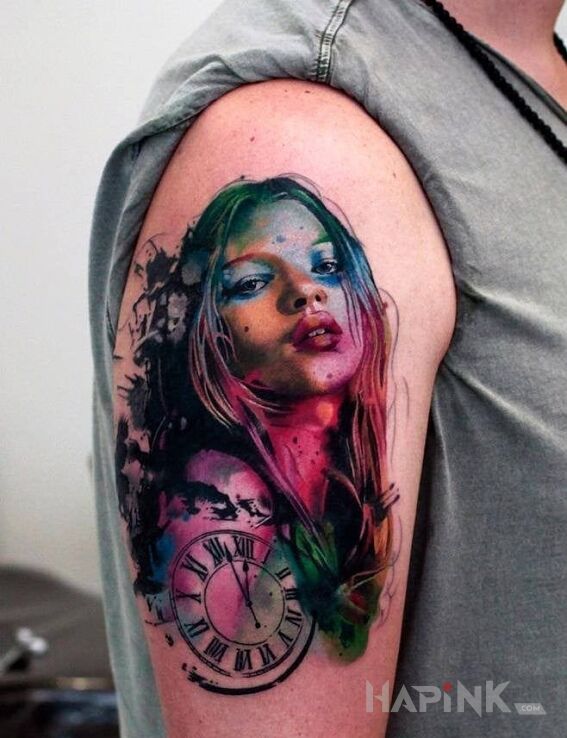 Tattoo Kate Moss in faces motif and realistic style on the upper arm