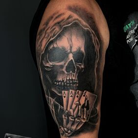 Tattoo DARK SKULL On the arm motif: dark style: realistic