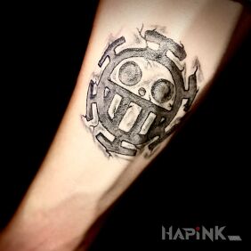 Tattoo ONE PIECE STAMP on the forearm motif: black and gray style: graphic / illustrative