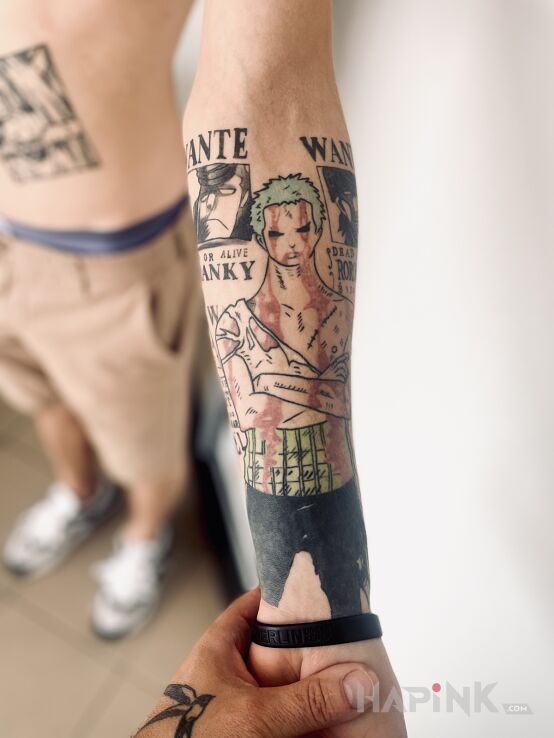 Tattoo One piece in manga / anime motif and graphic / illustrative style On the arm