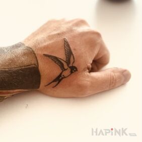 Tattoo Swallow on the hand motif: black and gray style: oldschool