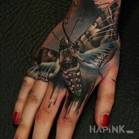 Tattoo Moth on the hand motif: 3D style: realistic