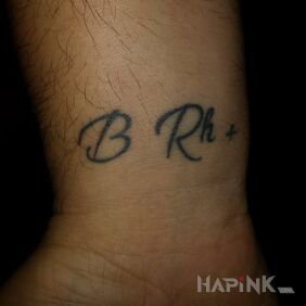 Tattoo Blood Group on the wrist motif: lettering