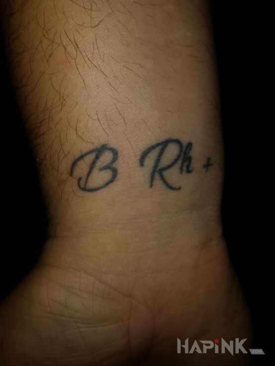 Tattoo Grupa Krwi in lettering motif on the wrist