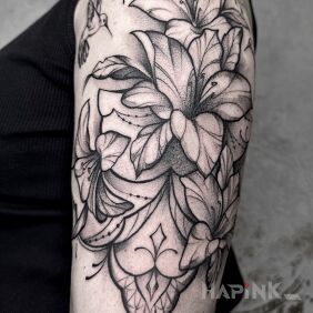 Tattoo Magnolia flower On the arm motif: black and gray style: graphic / illustrative