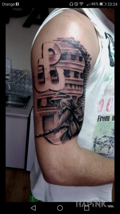 Tattoo Powstaniec ;] in patriotic motif on the upper arm