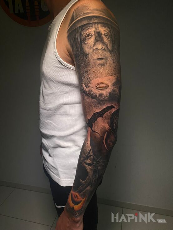 Tattoo LoTR sleeve in fantasy motif and realistic style On the arm