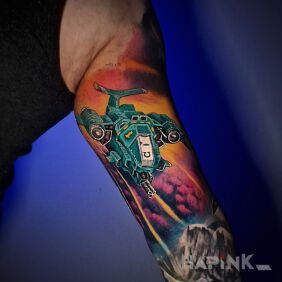 Tattoo Space and Ship on the bicep motif: colorful style: graphic / illustrative