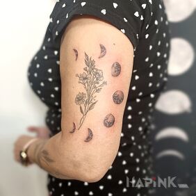 Tattoo Moon phases On the arm motif: flowers style: graphic / illustrative