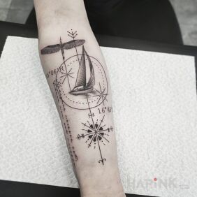 Tattoo Geometry and Travel on the forearm motif: lettering style: graphic / illustrative