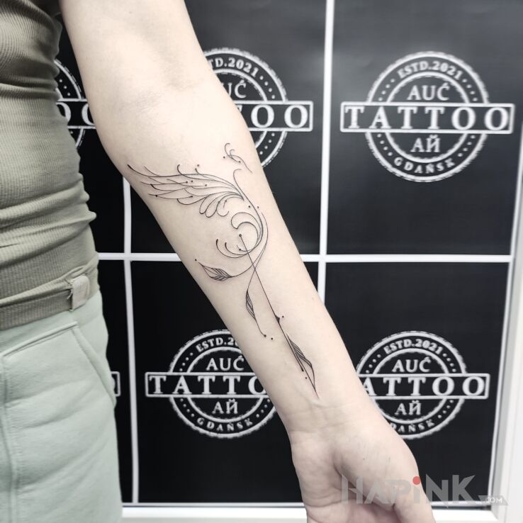 Tattoo Feniks in fantasy motif and minimalistic style on the forearm