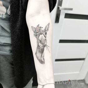 Tattoo Donkey on the forearm motif: black and gray style: realistic