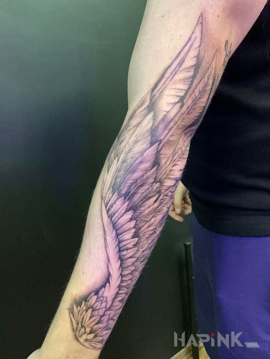 Tattoo Skrzydło in wings motif and realistic style on the bicep
