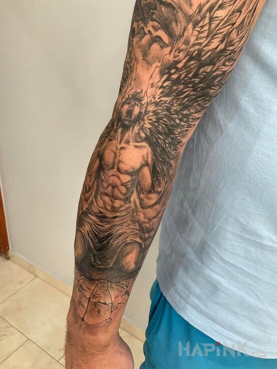 Tattoo Upadły anioł in characters motif and graphic / illustrative style On the arm