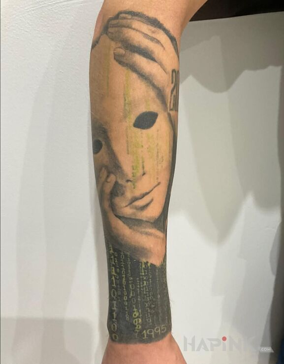 Tattoo Matrix (zagojony) in dark motif and realistic style on the forearm