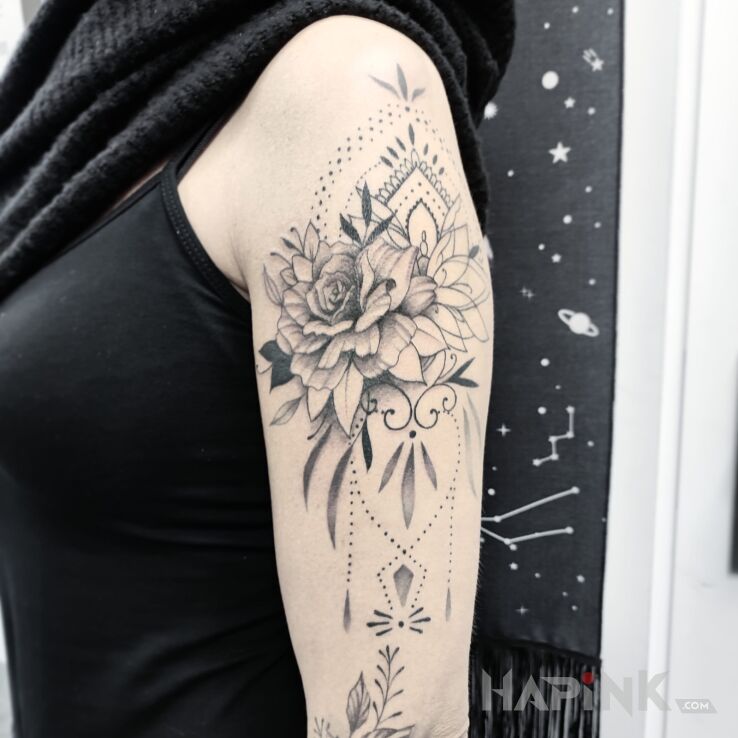 Tattoo Kwiaty in black and gray motif and graphic / illustrative style On the arm