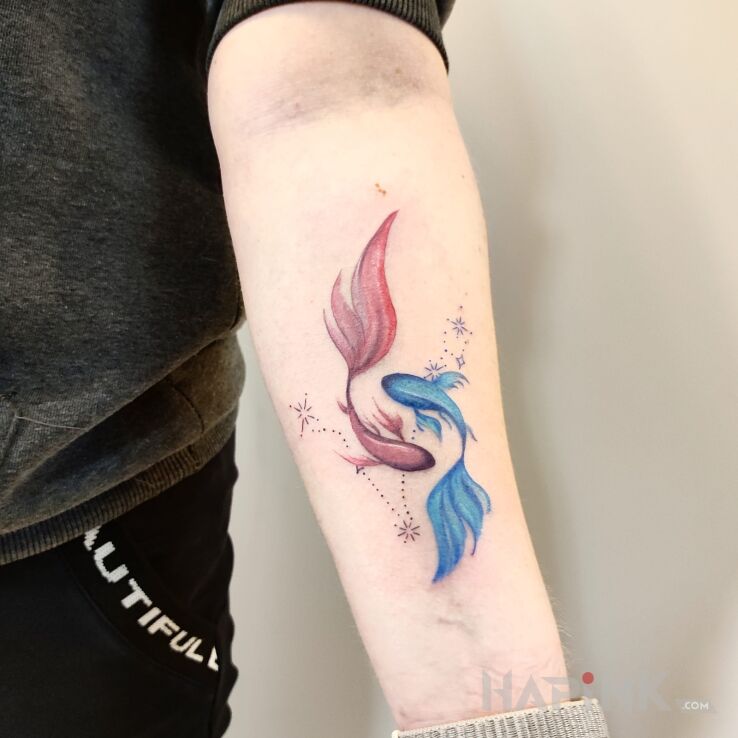 Tattoo Ryby in zodiac signs motif and graphic / illustrative style On the arm