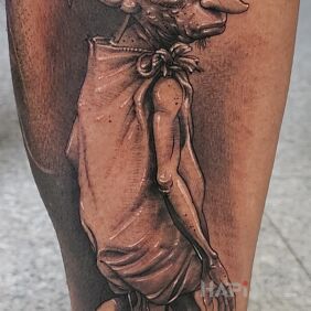 Tattoo Zgredek on the calf motif: fantasy style: realistic