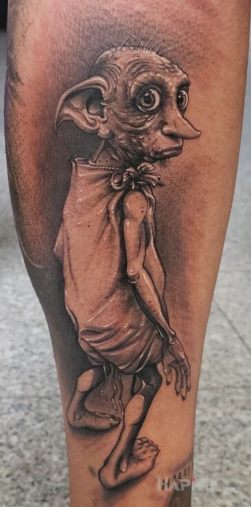 Tattoo Zgredek in characters motif and realistic style on the calf