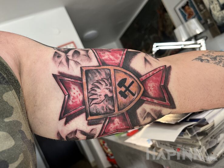 Tattoo Krzyż Maltański Ratowników Górniczych in patriotic motif and graphic / illustrative style On the arm