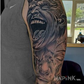 Tattoo Devilish cover On the arm motif: dark style: realistic