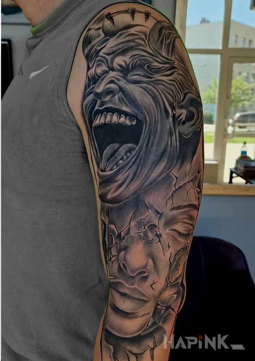 Tattoo Diabelny cover in black and gray motif and realistic style on the upper arm