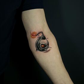 Tattoo COLOR BOMB On the arm motif: objects style: graphic / illustrative