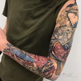 Tattoo Japanese folklore on the upper arm motif: flowers style: japanese / irezumi