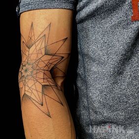 Tattoo Star in geometry on the upper arm motif: black and gray style: contour / linework