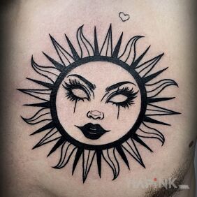Tattoo Sun with a woman's face on the chest motif: black and gray style: graphic / illustrative