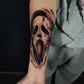 Tattoo GHOSTFACE on the forearm motif: black and gray style: graphic / illustrative