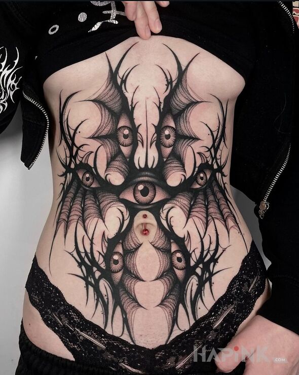 Tattoo Oczu multum in demons motif and graphic / illustrative style underboob