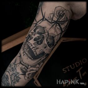 Tattoo Skull with a crown of thorns and a rose On the arm motif: skulls style: dotwork