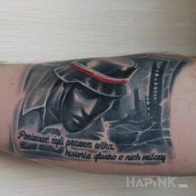 Tattoo POLAND on the forearm motif: lettering