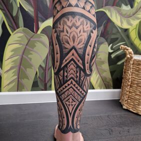Tattoo Polynesian mix calf with geometry on the leg motif: mandalas style: geometric